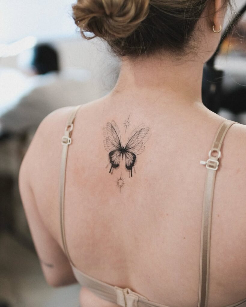 Simple butterfly tattoo for back women